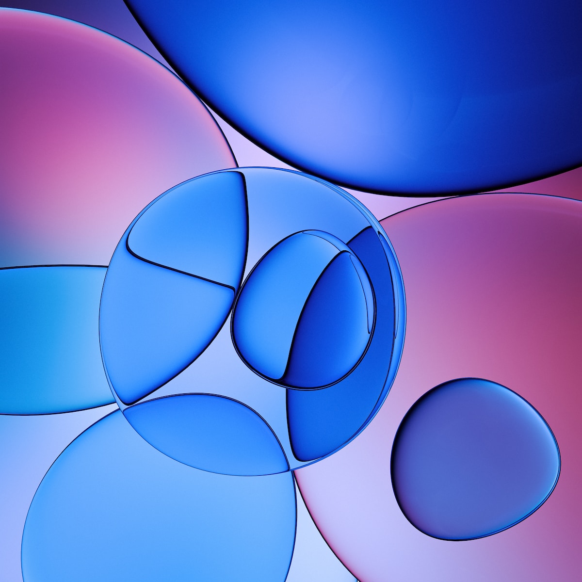 an abstract blue and pink background with circles